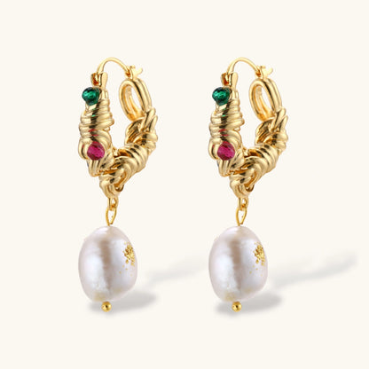 Ornate gold-plated hoop earrings with emerald, ruby, and sapphire accents, featuring dangling baroque freshwater pearls